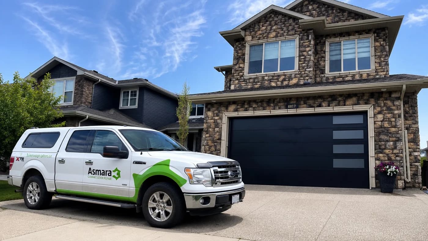 Asmara service truck outside an Edmonton home with a new black double garage door
